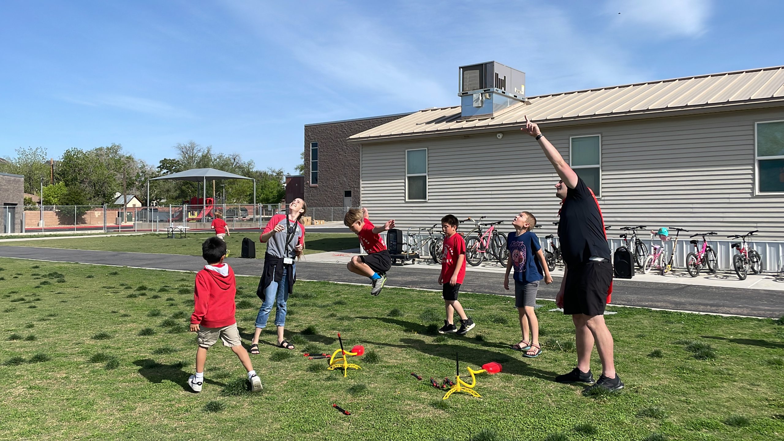 Students launch rockets to celebrate the IronKids run.